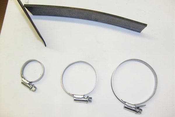Metaliniai spaustukai ir stora guma